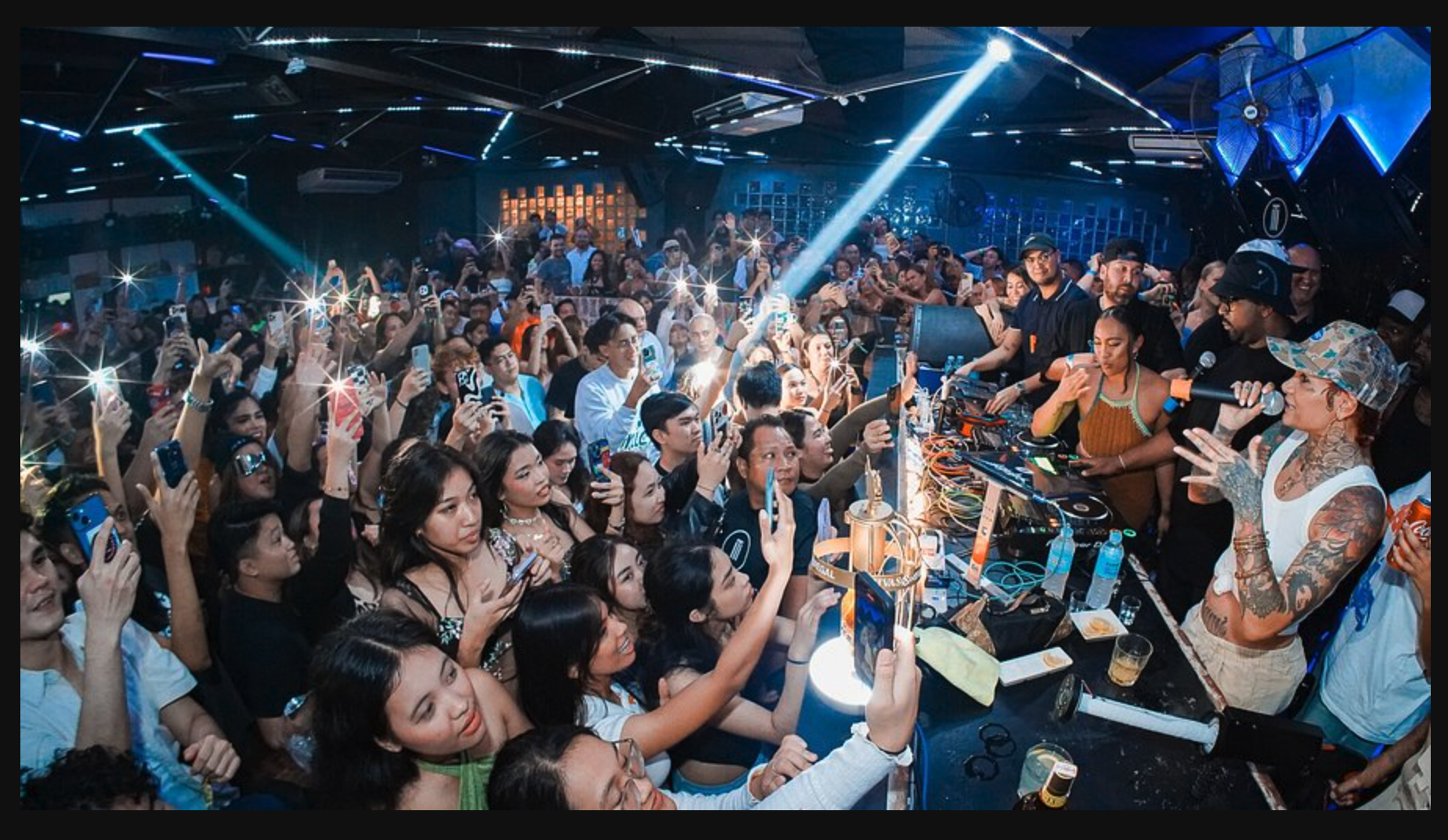 Modern nightclubs and high-rises in Cebu City at night.